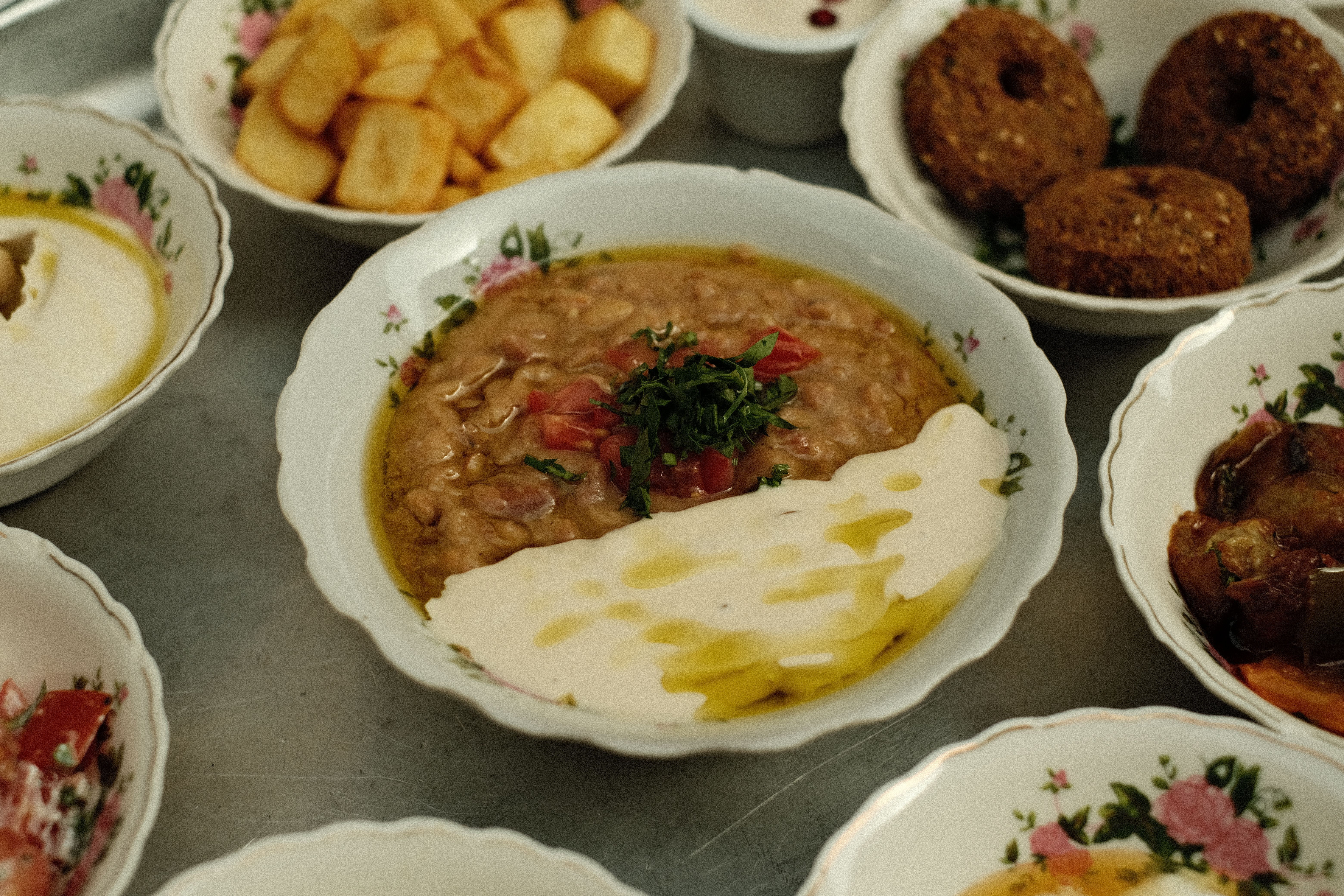 Explore an authentic Middle Eastern mezze platter with falafel, hummus, and more. Captured in Dubai.